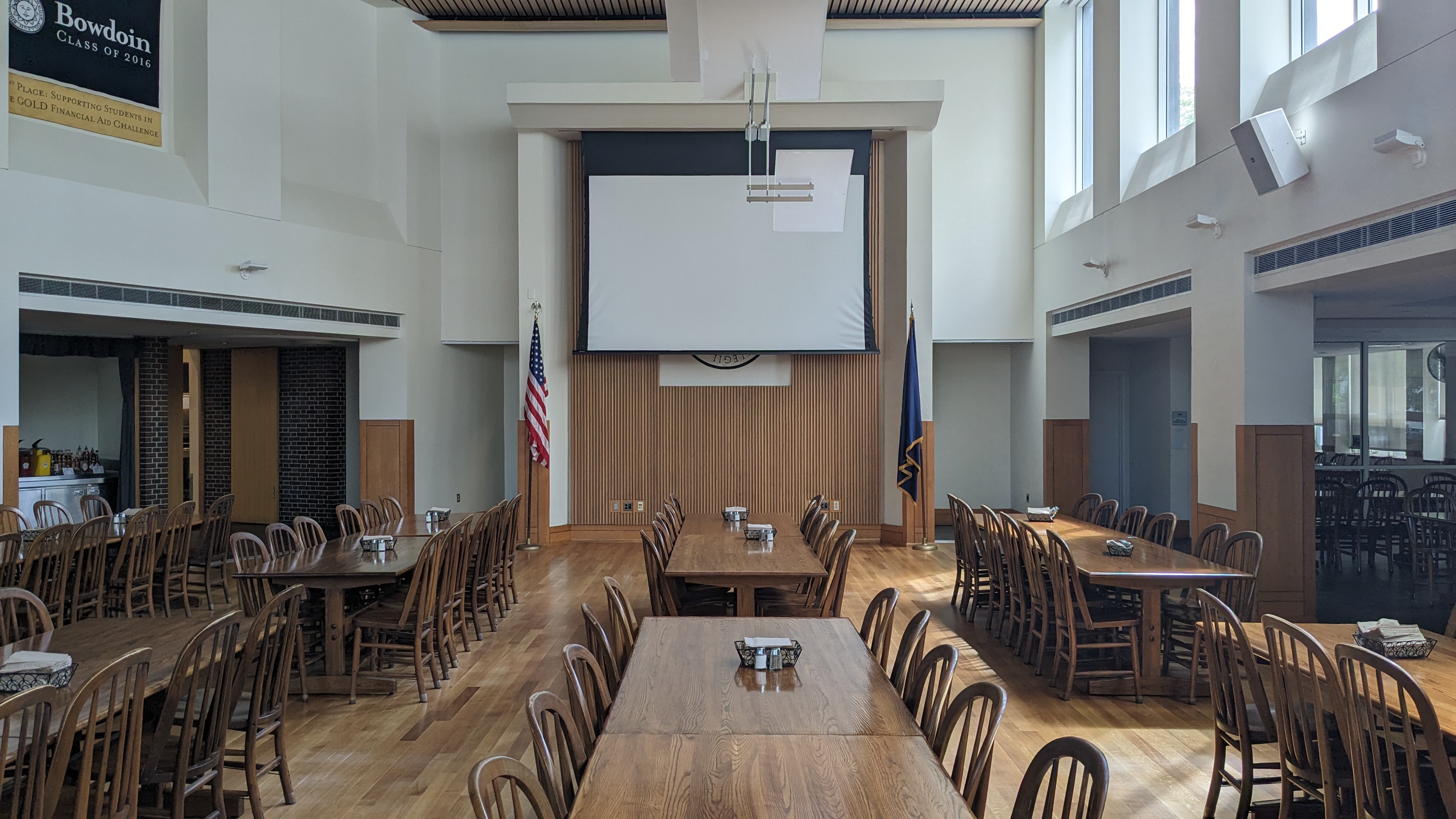 Large dining hall with long wooden tables.
