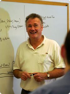 Allen Tucker standing in front of a whiteboard