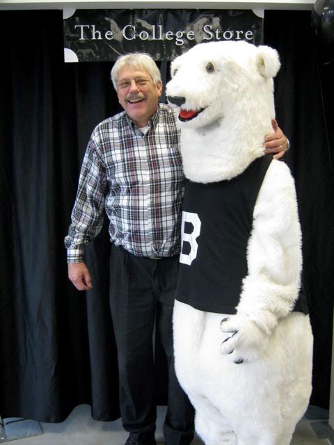 Murray Litchfield, Sr. Accounts Payable Rep Emeritus poses with Polar Bear mascot