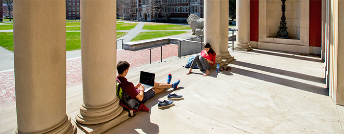 Students study on the steps of the Bowdoin College Museum of Art.