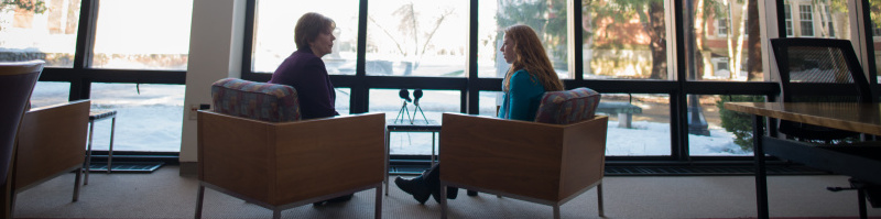 Interview photo two people talking in chairs