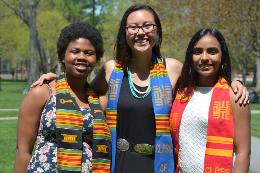 Three students posing at Commencement