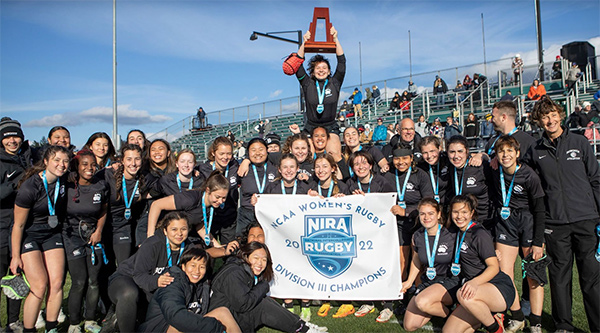 Bowdoin women's rugby holds the national trophy.