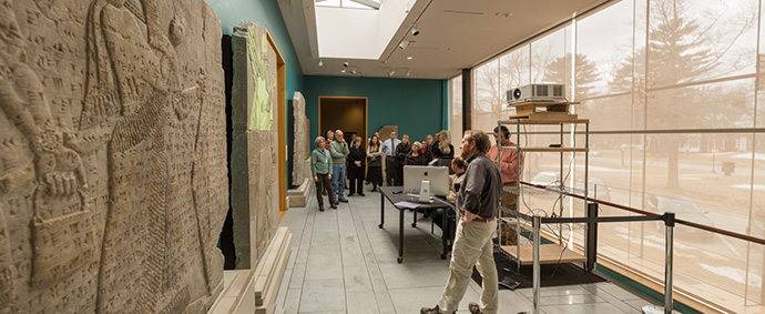 students observe asyria relief projection