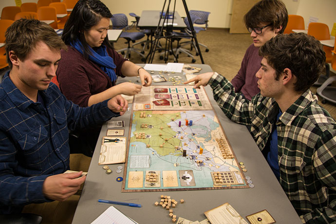 students play tabletop game