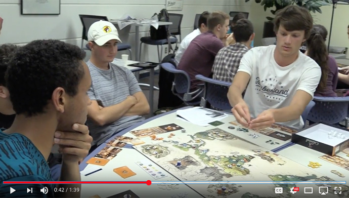 students play table top game