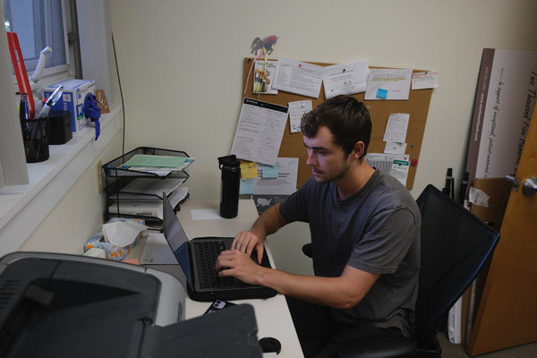 Jack sits at a desk, typing.