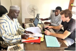 A group of people working around a table