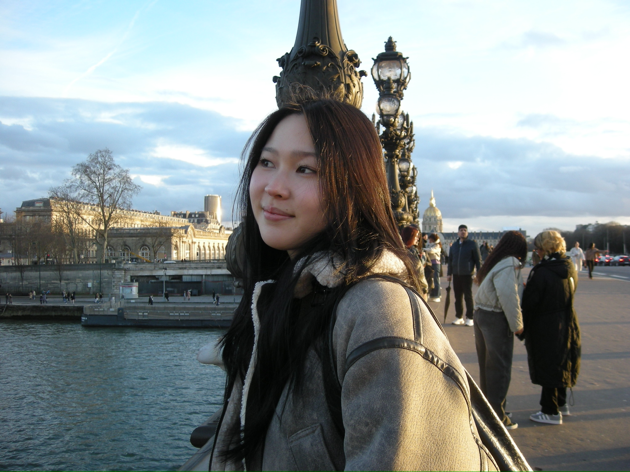 Paulina smiles while looking into the distance