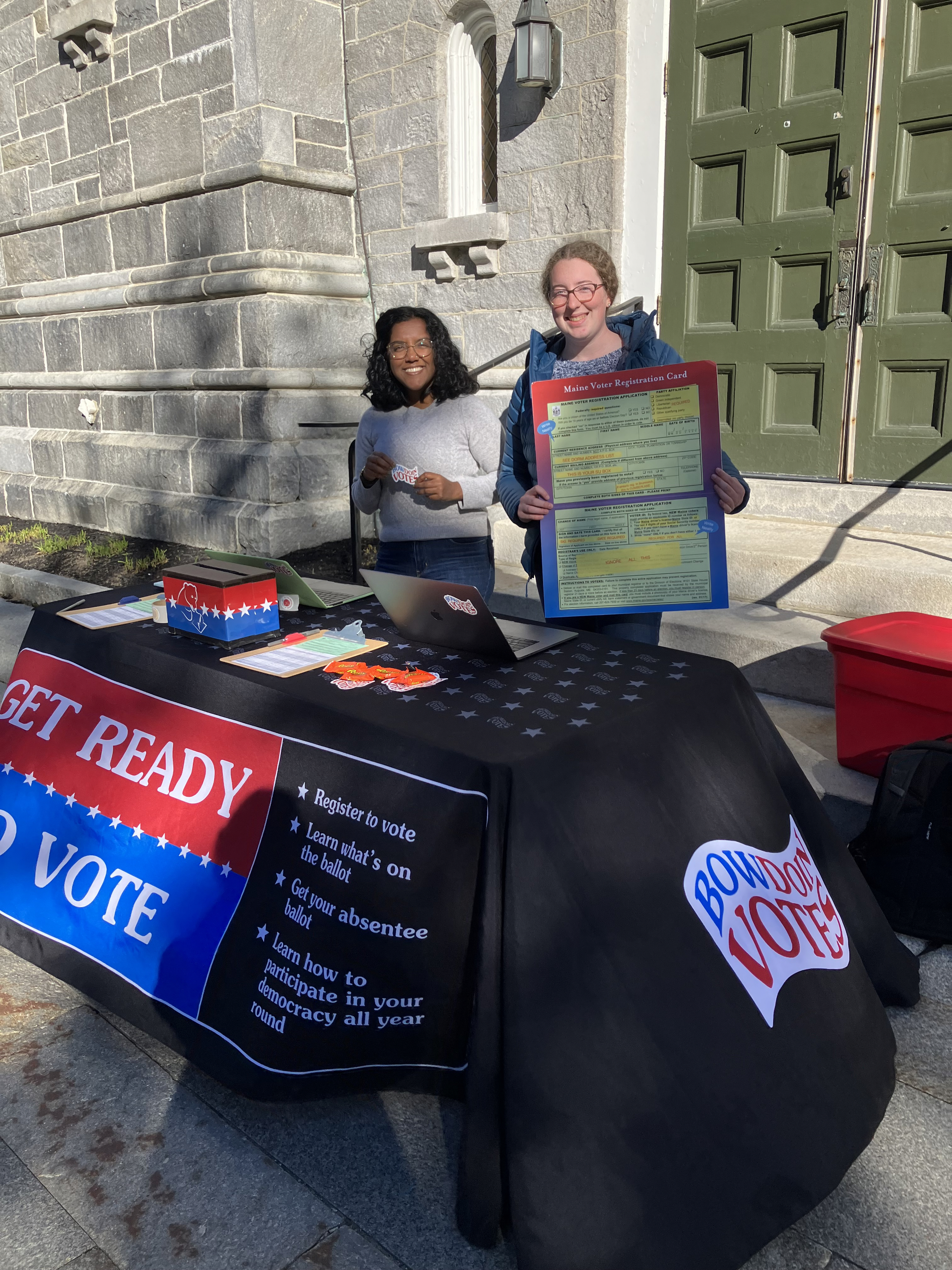 Student volunteers helping students register to vote