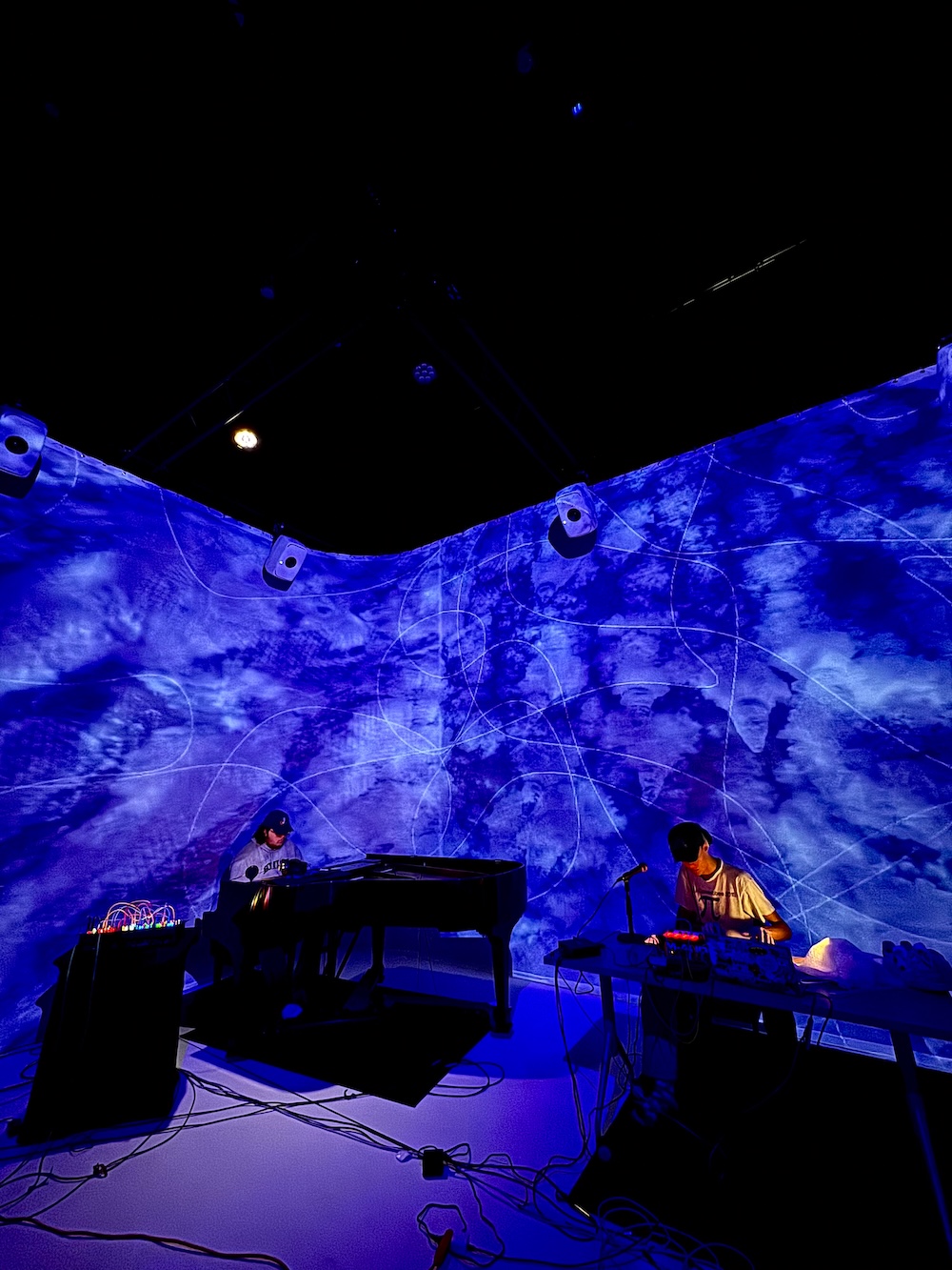 Electroacoustic ensemble performance with blue background