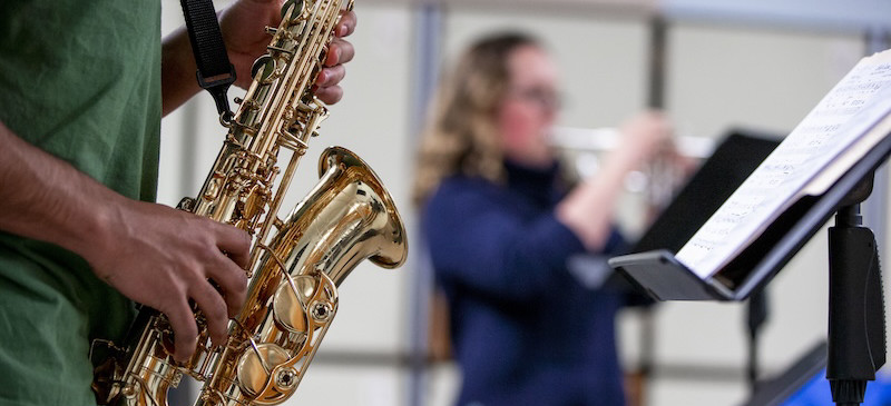Close up of student playing saxaphone