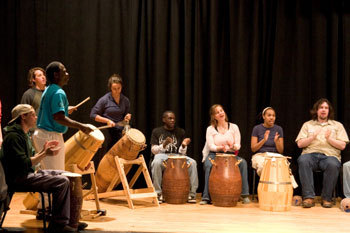 Students drumming in class