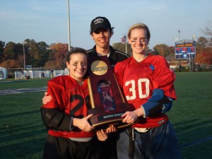 Emily Neilson '11 (right) with Kayla Lessard '13 and goalie coach Chris Waltham with the national championship trophy.