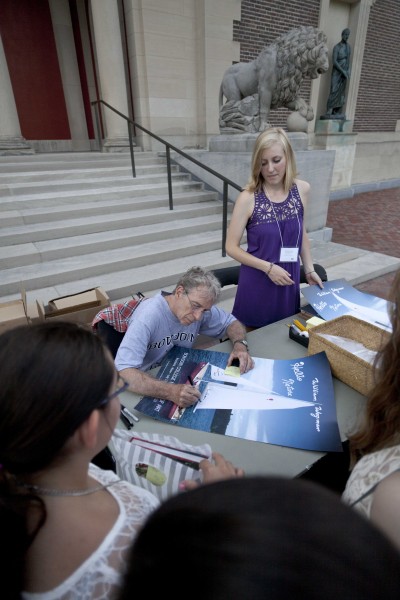 Artist William Wegman signing posters at the opening of “Hello Nature” at the Bowdoin College Museum of Art