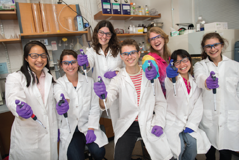 Danielle Dube (third from left) is one of two Bowdoin faculty members selected as individual investigators to be funded by Maine’s INBRE program. Van Tra ’13 (second from right) held a postbaccalaureate research position at Bowdoin through INBRE.