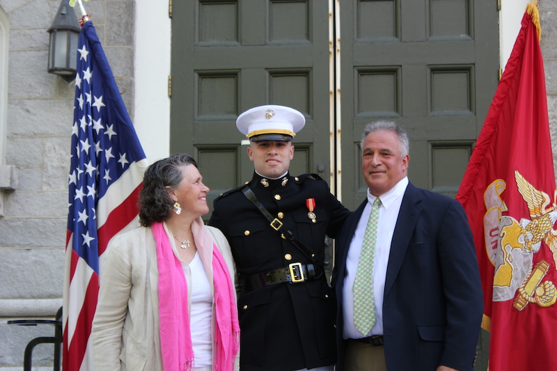 The U.S. Marine Corps held a commissioning ceremony for senior David “Mac” Caputi on Friday morning. Standing before the Bowdoin Chapel, in front of his family, coaches, professors and friends, Caputi took his oath and became a second lieutenant. Caputi’s parents, Beth Caputi and former Bowdoin football coach David Caputi, pinned his rank insignia on his shoulder epaulets. His parents also presented Caputi with a mameluke sword, the oldest type of weapon used by the U.S. armed forces. Caputi trained for two summers at the Officers Candidate School in Quantico, Va., passing the rigorous physical, mental and emotional tests to become an officer. Following graduation, Caputi will attend The Basic School for six months in Quantico, where he will study such topics as leadership, war fighting philosophies, and how to conduct humanitarian operations. After that, he’ll pursue advanced schooling in a particular field. At the conclusion of the ceremony, Caputi thanked the many people — “teachers, professors, advisors, mentors, instructors, marines, coaches, classmates, teammates, friends and family” who he said had inspired him to pursue this path “to become the best man, and now the best Marine Corps officer,” he could be.