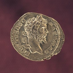 A small silver coin of Roman emperor Septimius Severus (146–211 CE)