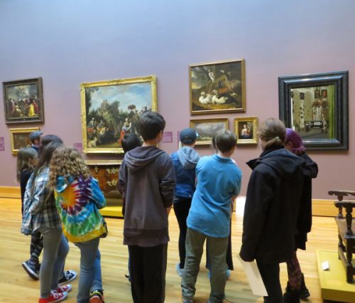 A school group enjoys a tour at the Bowdoin College Museum of Art.