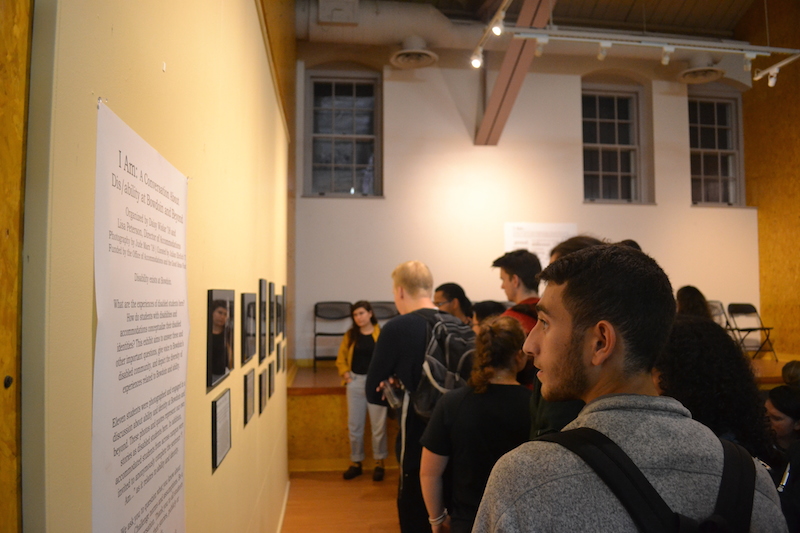 A student at the “Dis/ability” show opening. Photo by Henry Bredar ’19