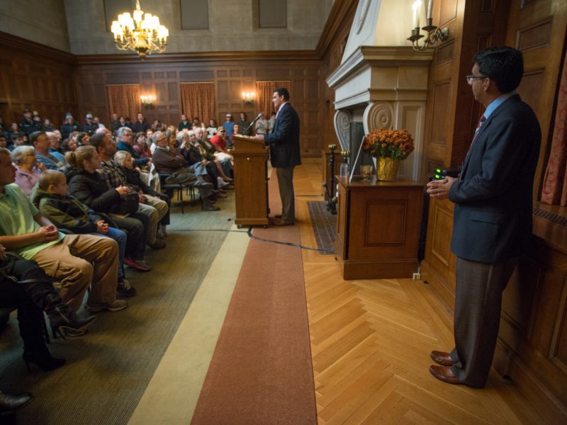 Dinesh D'Souza being introduced to the Bowdoin crowd by student Republican Francisco Navarro '19,