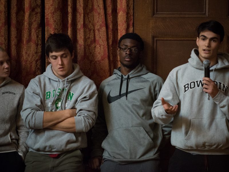 A student asks D'Souza a question