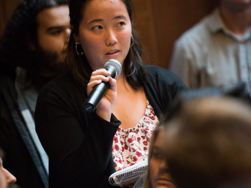 A student asks D'Souza a question