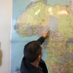 Scott MacEachern points to the Lake Chad Basin on a map in his office
