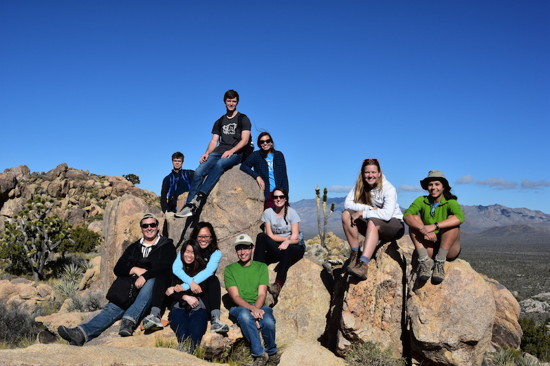 Students in the Plant Ecophysiology course, taught by Professor of Biology Barry Logan and Laboratory Instructor Jaret Reblin, pose for a photo in the Mojave Desert, which they visited over Thanksgiving break