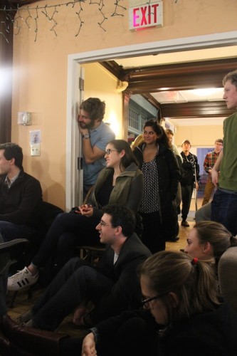 Students crowded into Reed House to hear the debate