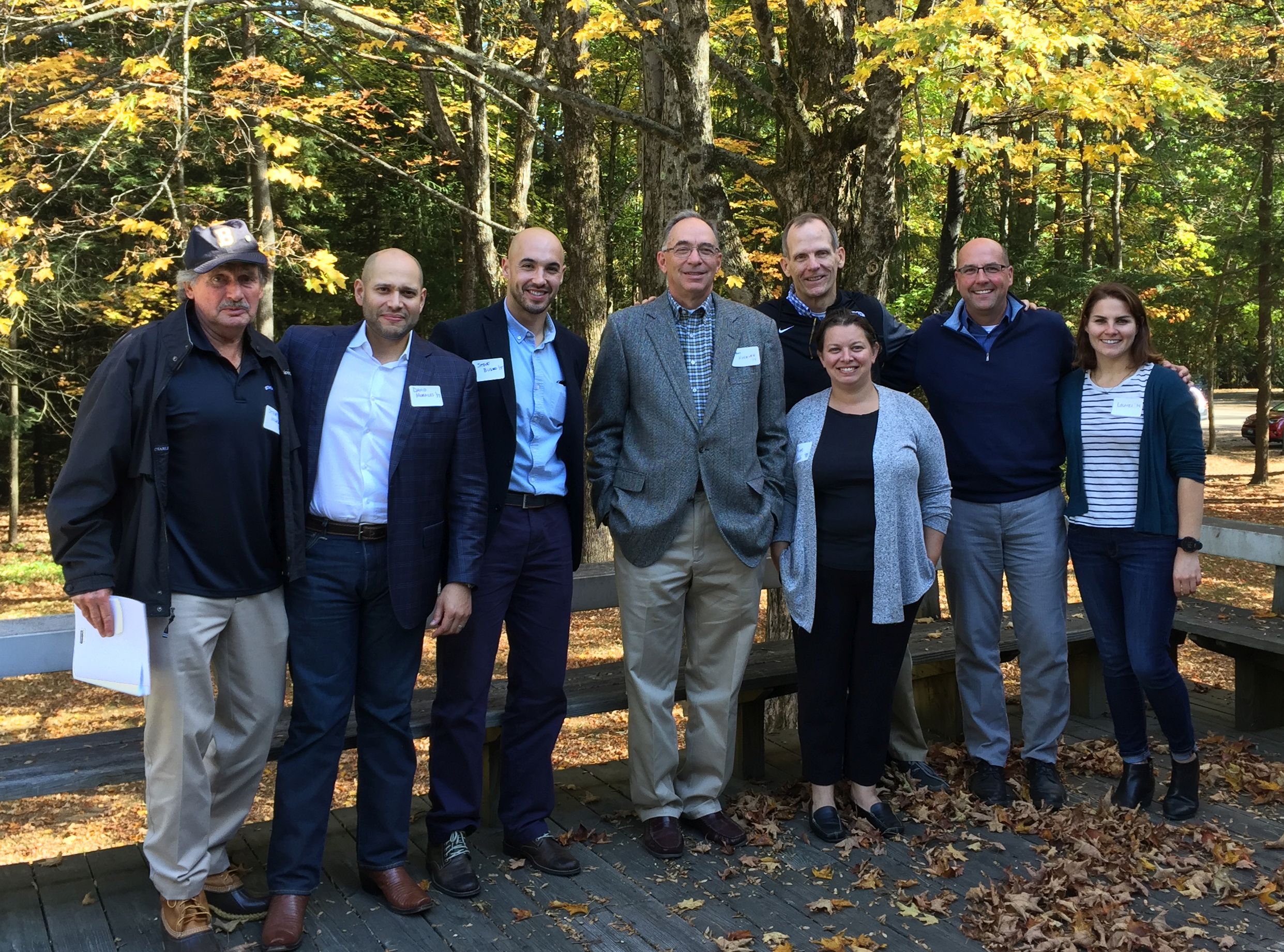 (L. to r.) Steve Ingram ’65, David Morales ’97, Steve Buduo ’15, Tom Hoerner ’74, Kim Pacelli ’98, (behind Kim) Dan Spears ’81, Peter LaMontagne ’88, and Laurel Varnell ‘14