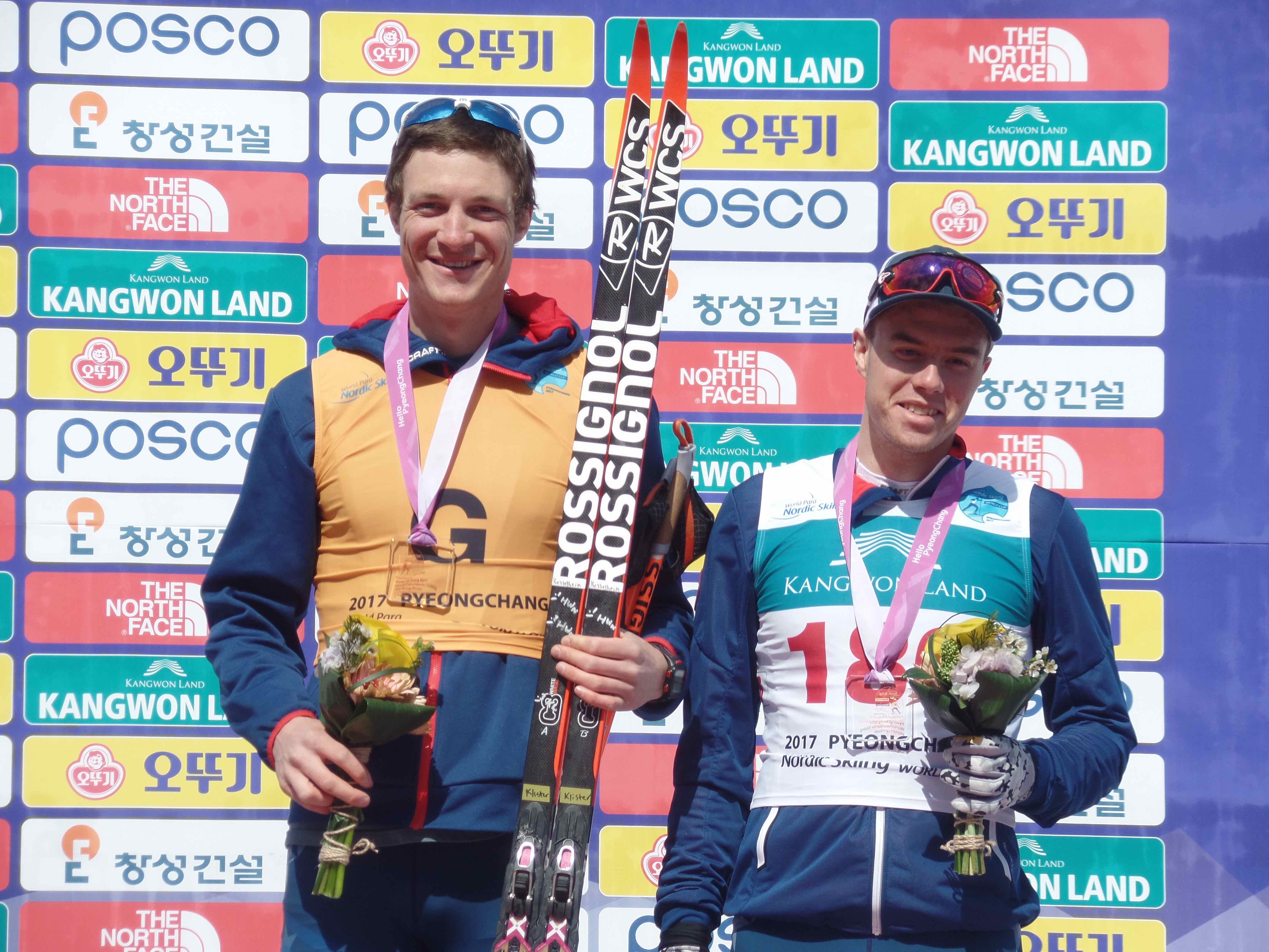 Jake Adicoff '18 (right) at the PyeongChang 2018 Test Event and World Cup winners podium with guide Sawyer Kesselheim. Photo: US Para Nordic Team Director John Farra
