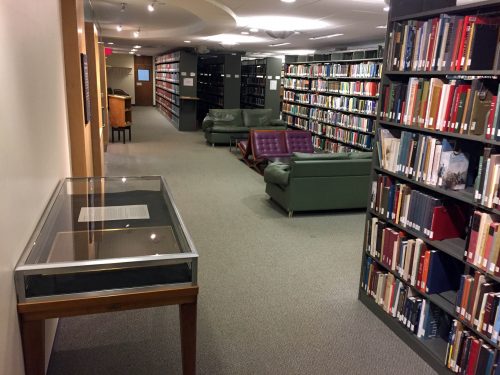 Display case containing Confederate plaque in library