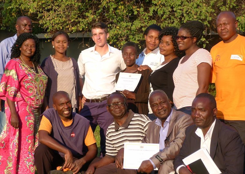 Lonnie Hackett ’14 with Zambian teachers trained by Healthy Kids/Brighter Future to be school health workers