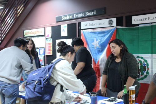 Cindy Rivera ’18 talks to a student in the Smith Union