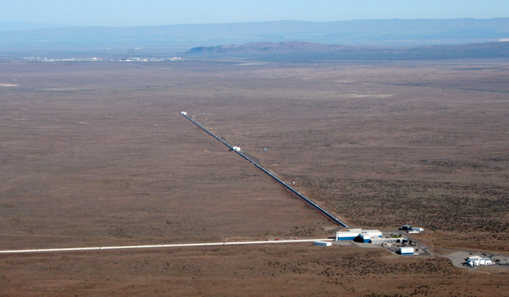 LIGO Observatory, in Hanford, WA. Visible are the two 4km arms containing vacuum chambers used to detect gravitational wave activity. (Courtesy: LIGO Laboratory)