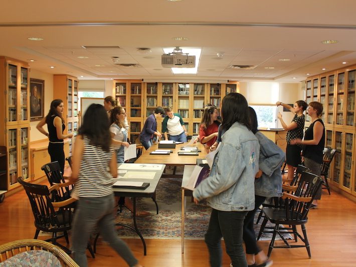 The sociology class rotated through the five stations of materials dedicated to the history of African American students at Bowdoin