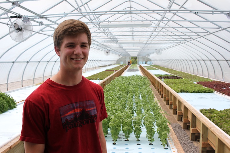Trevor Kenkel ’18 in his greenhouse