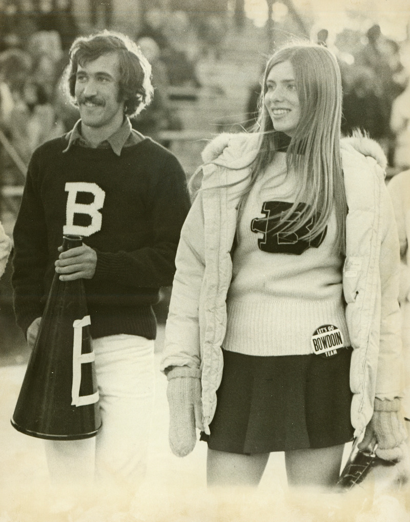Two Bowdoin cheerleaders in 1975, Robert Princenthal ’76 and Alison Brent ’76