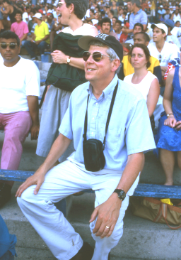 Allen Wells enjoys a baseball game in Havana, Cuba, 2000. Photograph: Nat Wheelwright