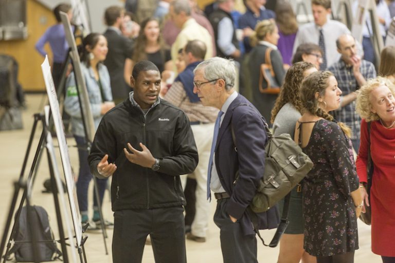 Student talking during 2017 President’s Summer Research Symposium