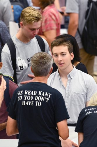 Atticus Kangas, ’22 learns about a course from Philosophy Professor Matthew Stuart at the academic fair. August 27, 2018. Photo by Fred J. Field.