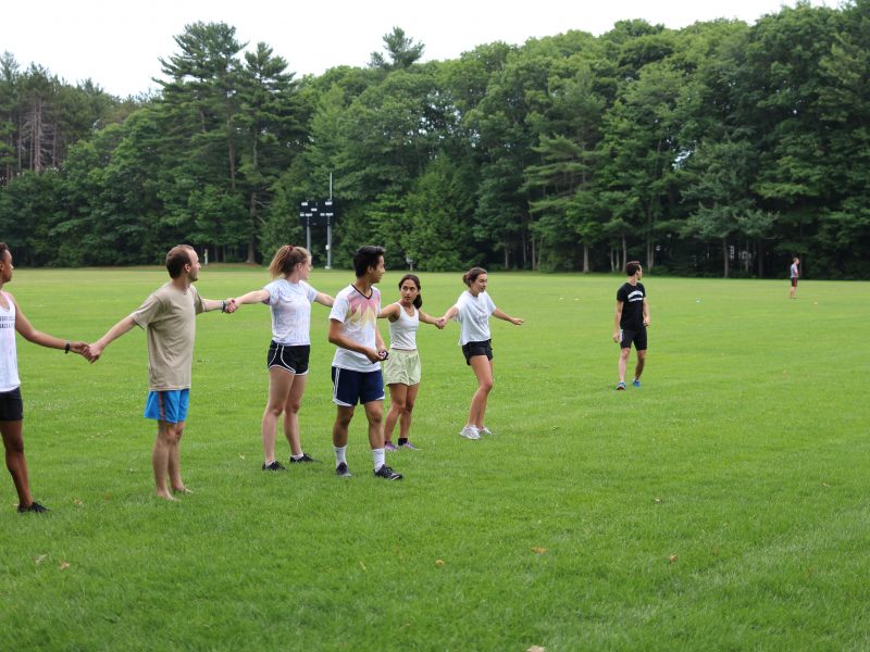 Chris Li '19 takes shelter near his team's chain of jailed players.