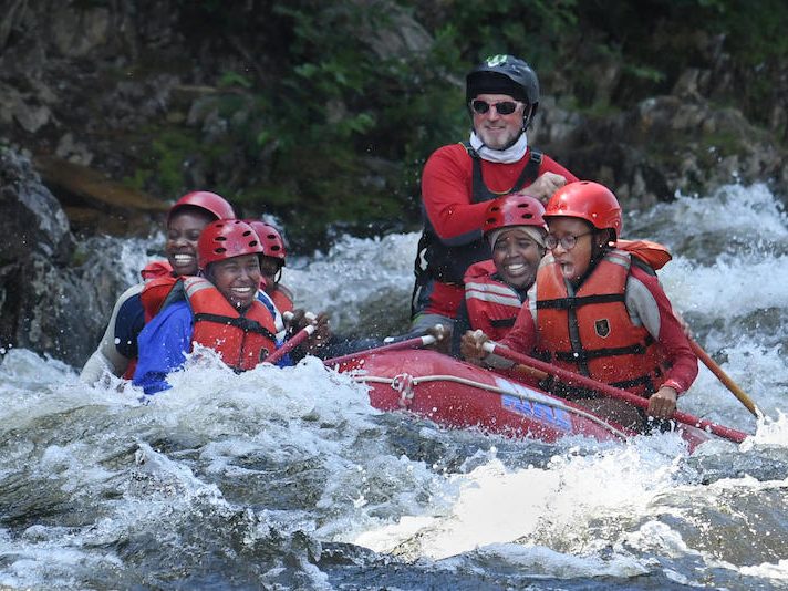 Geoffrey Canada Scholars and Bowdoin Outing Club director Michael Woodruff white water rafting