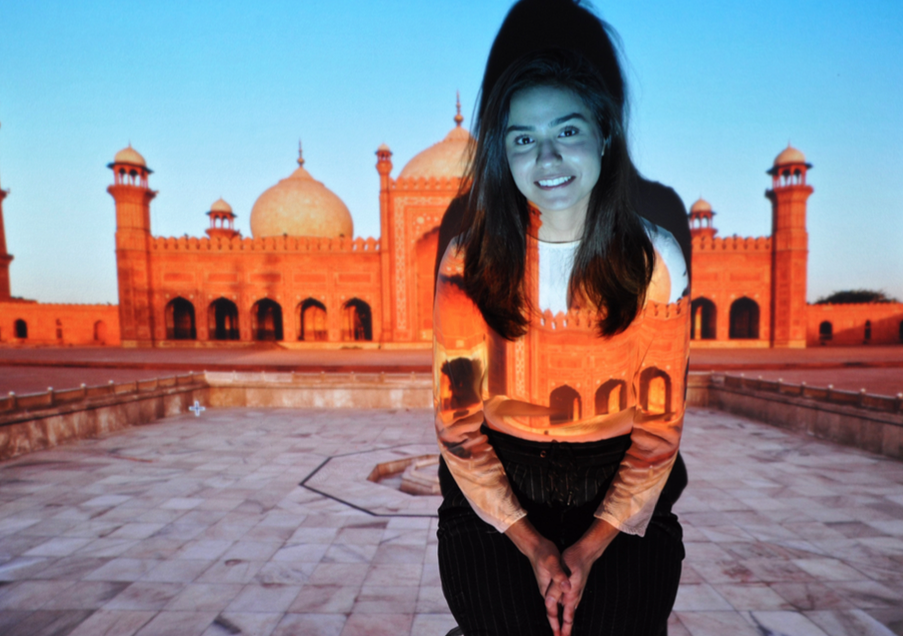 Mishal Kazmi ’21 in front of a picture of Bashahi Mosque in Lahore. Photo: Shinhee Kang ’18