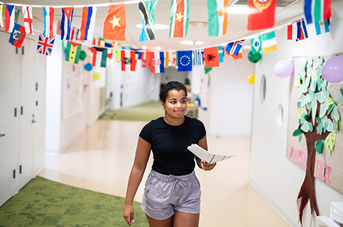 Thea Kelsey in the hallway of The Quad Manhattan