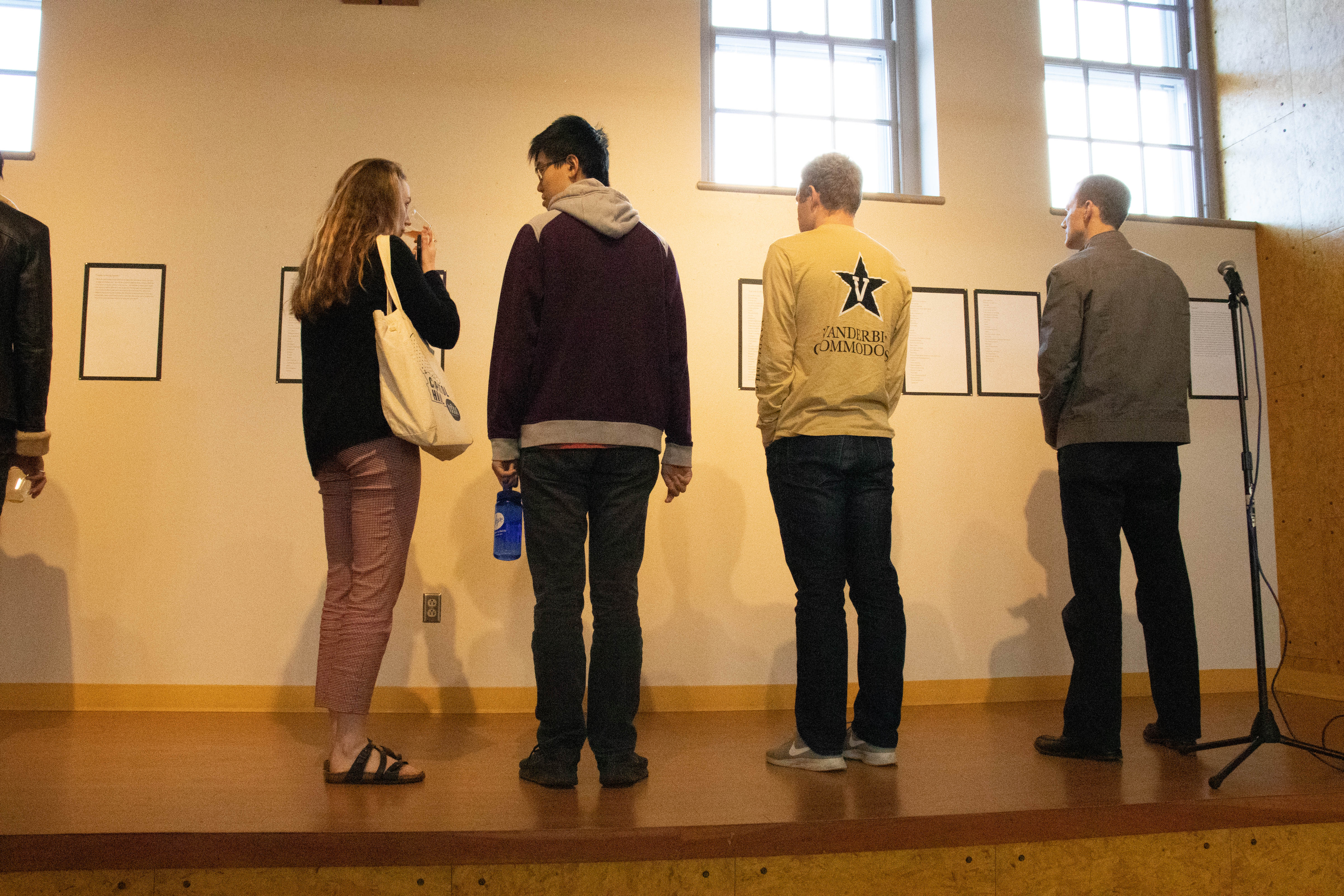 students reading writing on stage