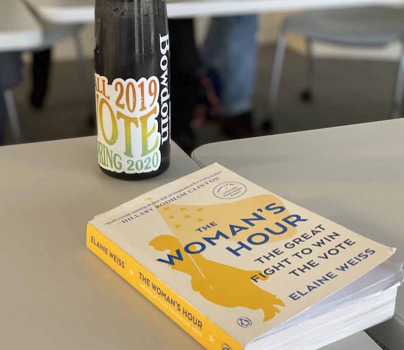 Water bottle with Bowdoin Votes sticker next to copy of Weiss's book