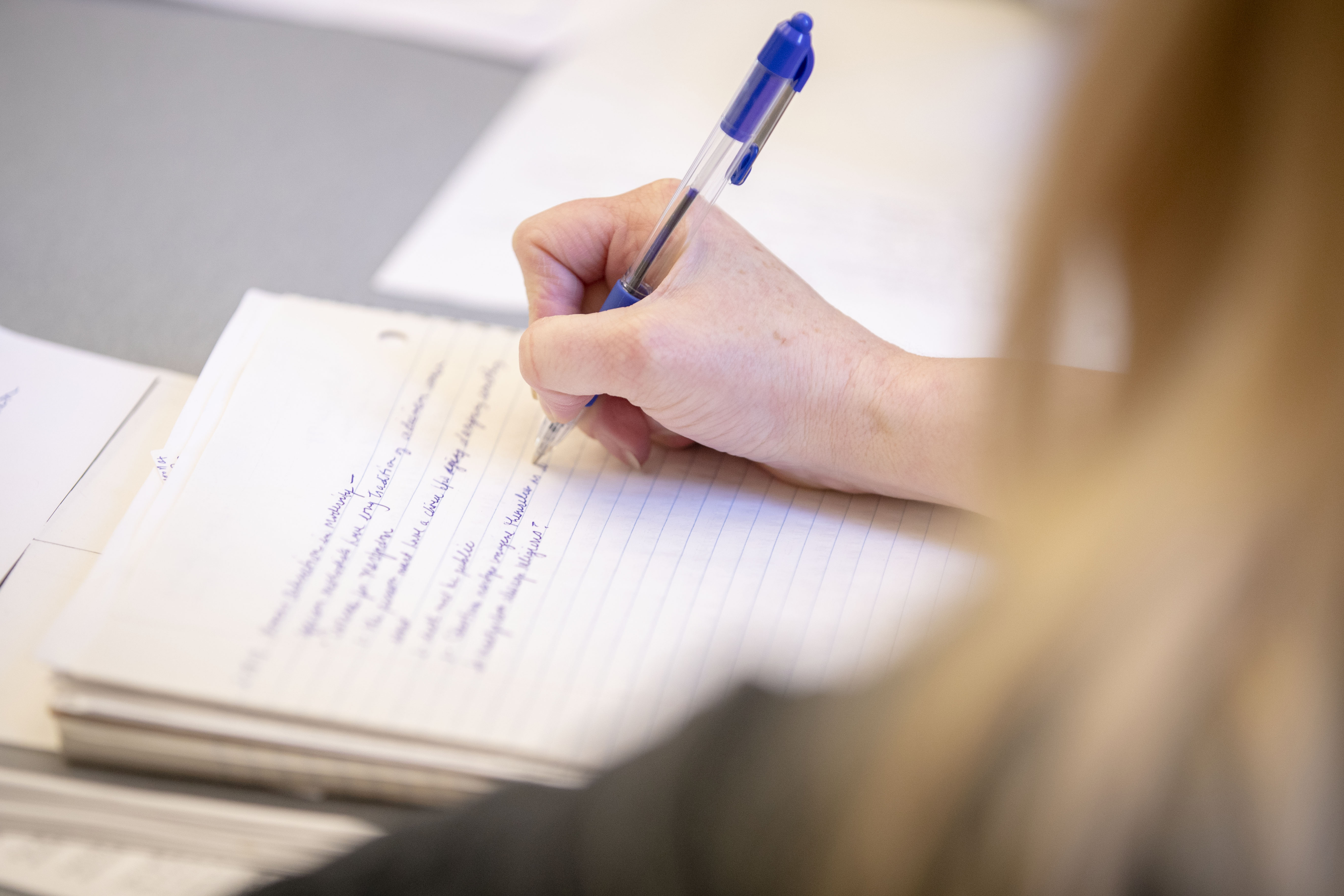 Lisa Bouffard writing notes in class