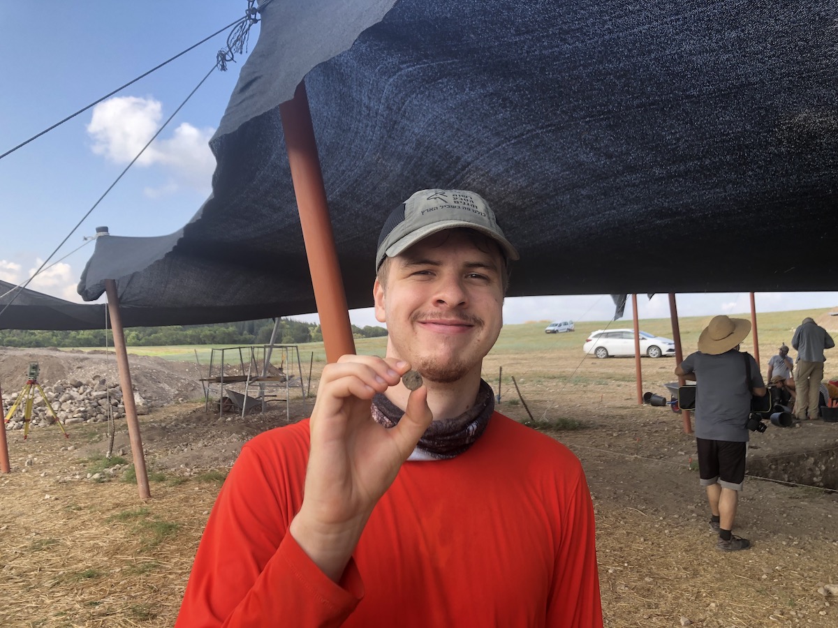 Cole Crawford shows a Roman coin he found